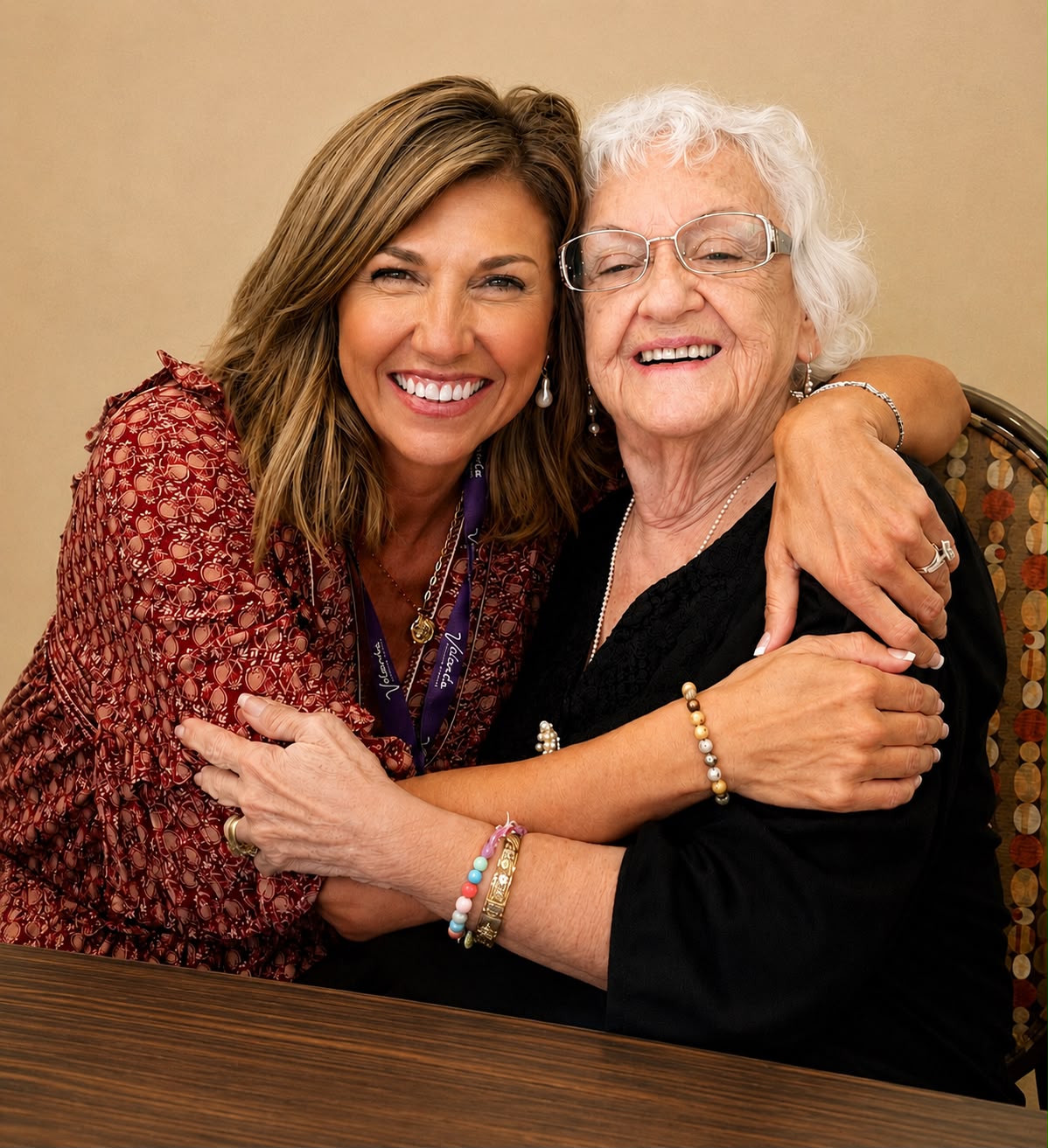 Traci Gerolstein embracing a smiling senior resident